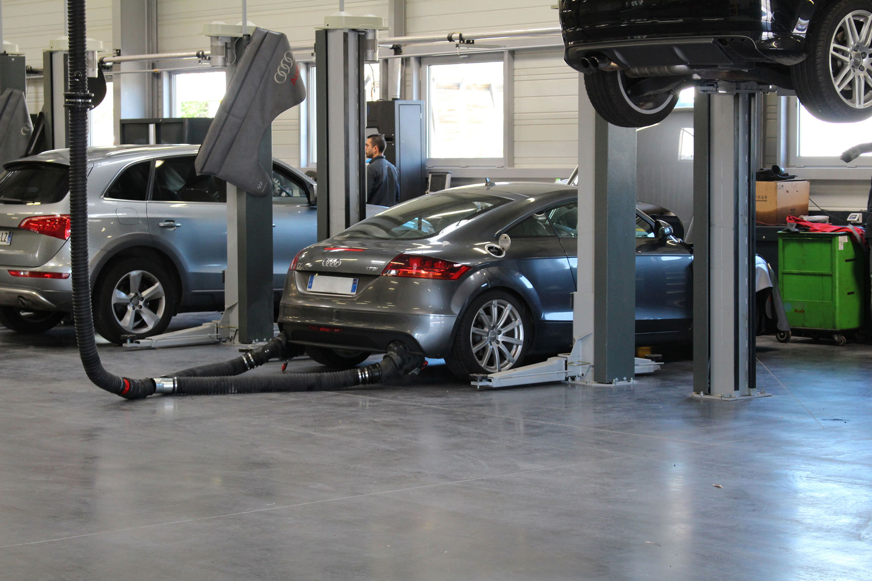 Grey Audi TT RS is repaired inside an authorised AUDI dealer